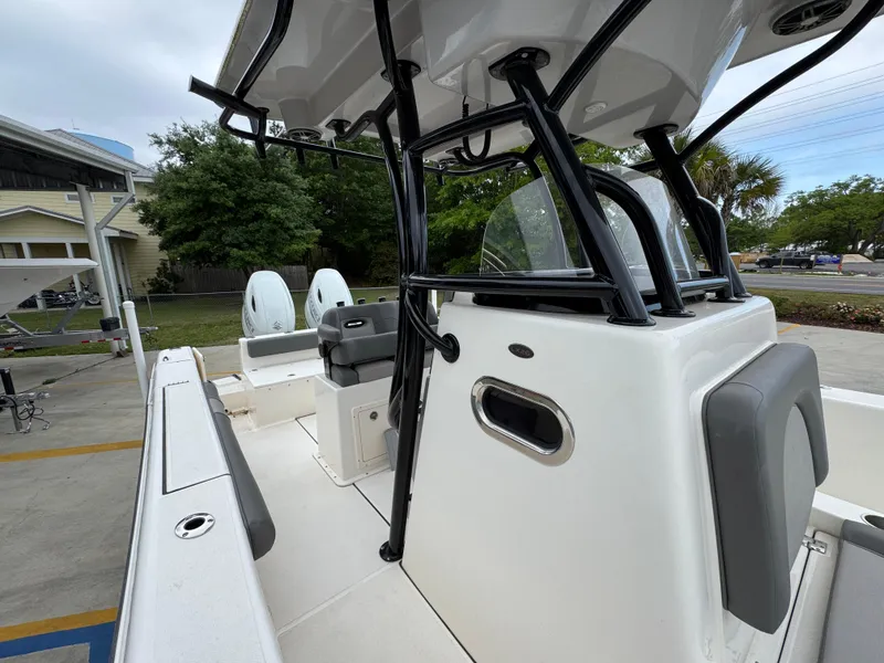 Slide: The Image of 2023 Sea Born LX26 Center Console boat with dual engines and sleek design. - 24