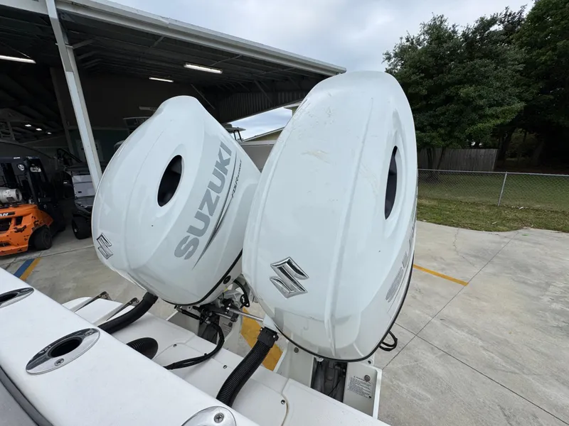Slide: The Image of 2023 Sea Born LX26 Center Console with dual Suzuki outboard motors. - 33
