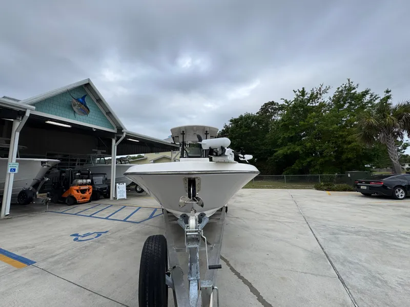 Slide: The Image of 2023 Sea Born LX26 Center Console boat on trailer at dealership. - 6