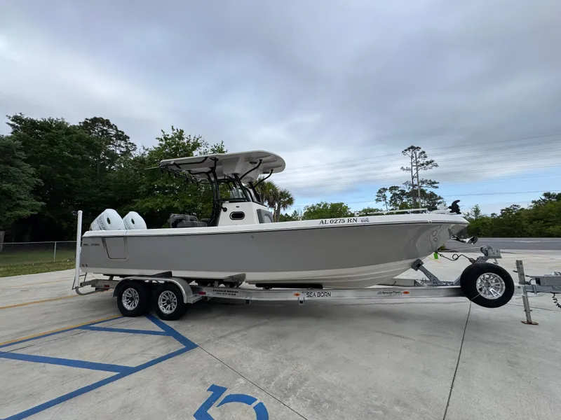 Slide: The Image of 2023 Sea Born LX26 Center Console boat on a trailer in a parking lot. - 9