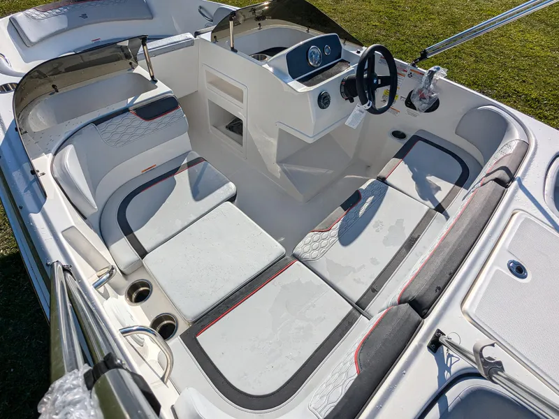 Slide: The Image of 2025 Bayliner Element M17 boat interior with modern seating and steering console. - 12