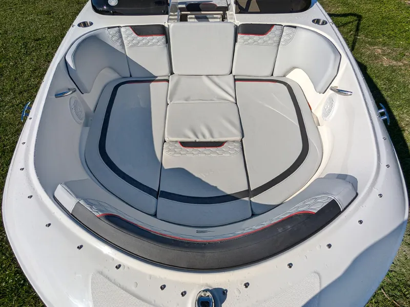 Slide: The Image of 2025 Bayliner Element M17 boat interior with cushioned seating and modern design. - 13