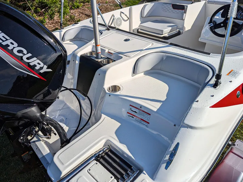 Slide: The Image of 2025 Bayliner Element M17 boat interior with Mercury engine, showcasing seating and deck layout. - 8