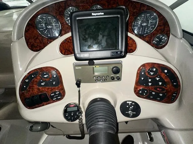 Slide: The Image of Control panel of a 2006 Sea Ray 280 Sundancer boat with navigation equipment. - 14