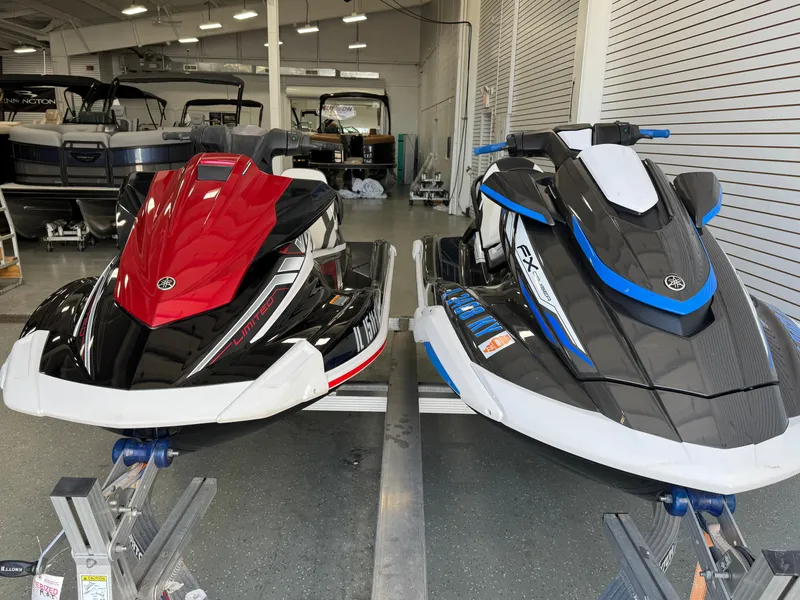 Slide: The Image of 2019 Yamaha WaveRunner FX Cruiser HO jet skis in showroom, red and black, blue and white models. - 16