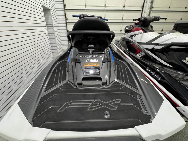 Slide: The Image of 2019 Yamaha WaveRunner FX Cruiser HO in a garage, showcasing sleek design and branding. - 21