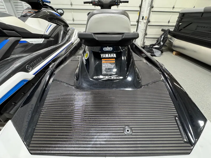 Slide: The Image of 2019 Yamaha WaveRunner FX Cruiser HO in a garage, showcasing rear deck and seat. - 22