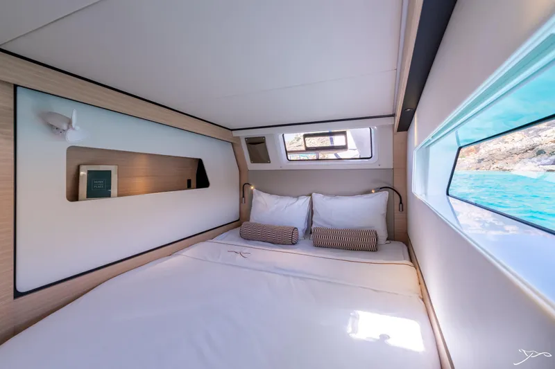 Slide: The Image of Luxurious cabin interior of 2025 Nautitech 44 Open yacht with scenic window views. - 49