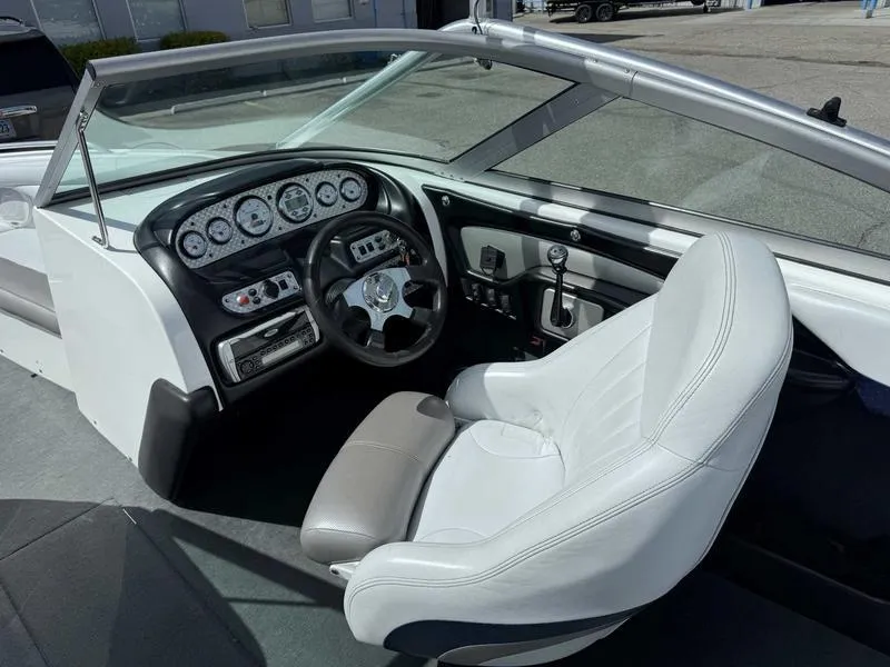 Slide: The Image of 2004 MasterCraft X30 boat interior with steering wheel and dashboard controls. - 11