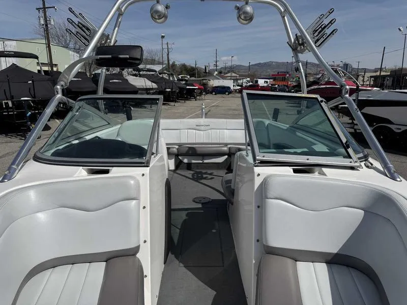 Slide: The Image of 2004 MasterCraft X30 boat interior with open windshield and seating. - 14