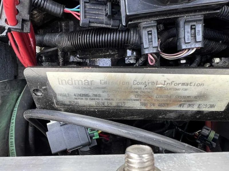 Slide: The Image of 2004 MasterCraft X30 engine with Indmar emission control label and wiring. - 16