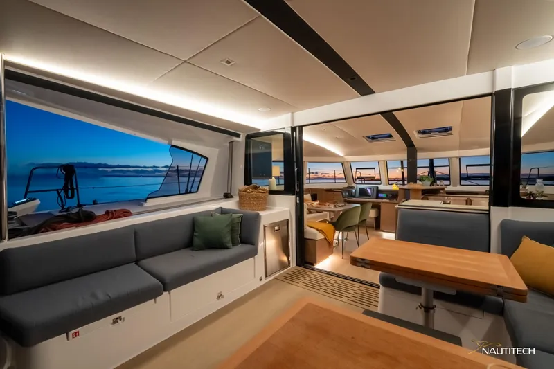 Slide: The Image of Luxurious interior of 2025 Nautitech 48 Open catamaran with modern seating and ocean view. - 29