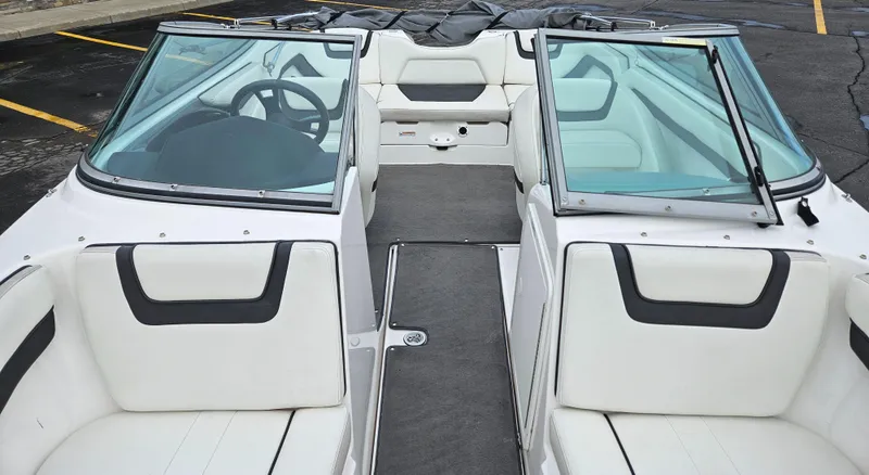 Slide: The Image of 2015 Yamaha Boats SX190 interior with white seating and steering wheel. - 11