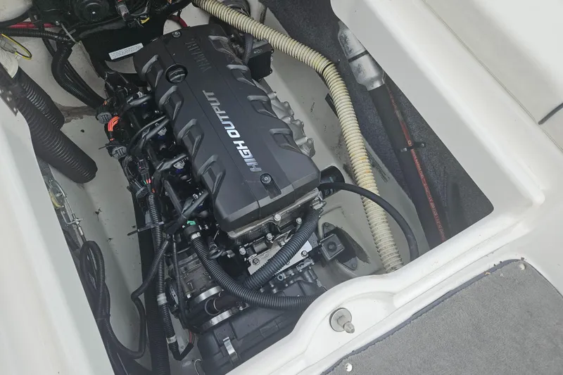 Slide: The Image of Engine compartment of a 2015 Yamaha Boats SX190, featuring a high output engine. - 13