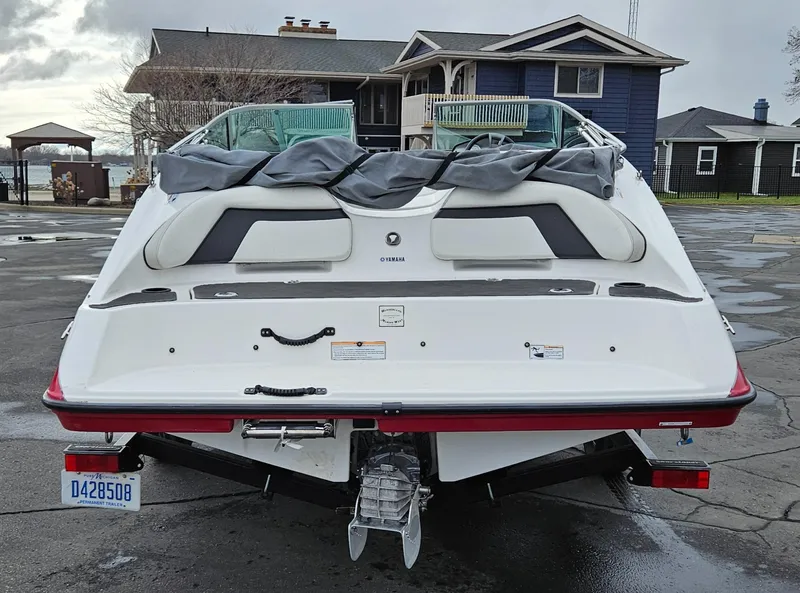 Slide: The Image of 2015 Yamaha Boats SX190 parked near waterfront homes. - 3