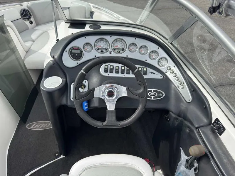 Slide: The Image of 2006 Tigé 22V boat dashboard with steering wheel and instrument panel. - 10