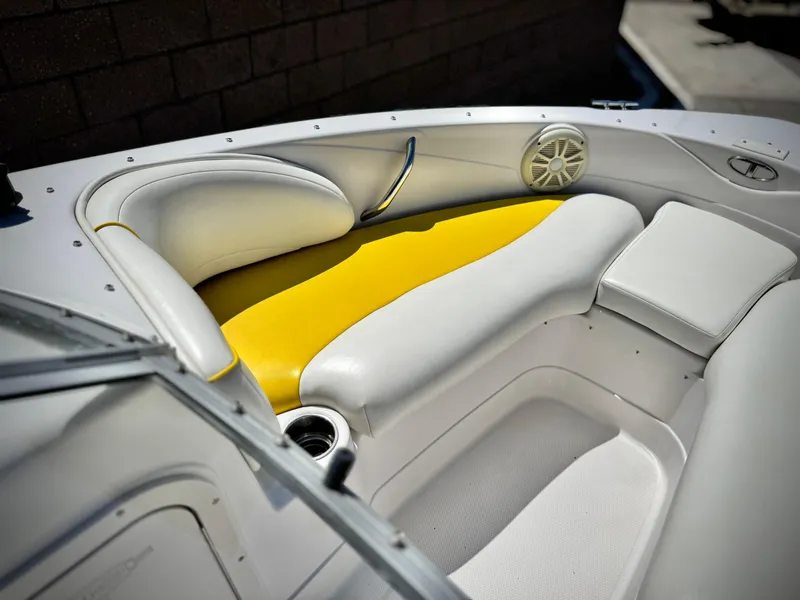 Slide: The Image of 2011 Tahoe Q8 SSi boat interior with white and yellow seating. - 10