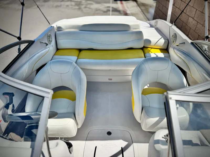Slide: The Image of Interior of 2011 Tahoe Q8 SSi boat with white and yellow seating. - 13
