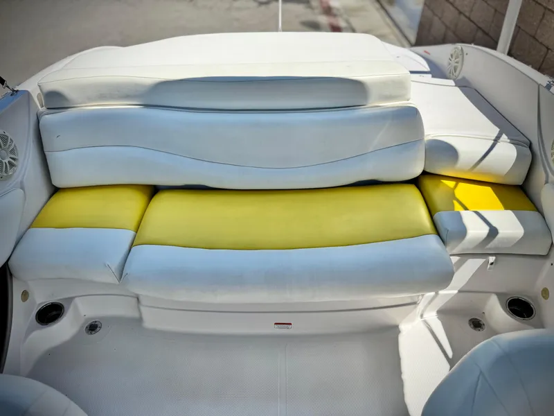 Slide: The Image of 2011 Tahoe Q8 SSi boat interior with white and yellow seating. - 14