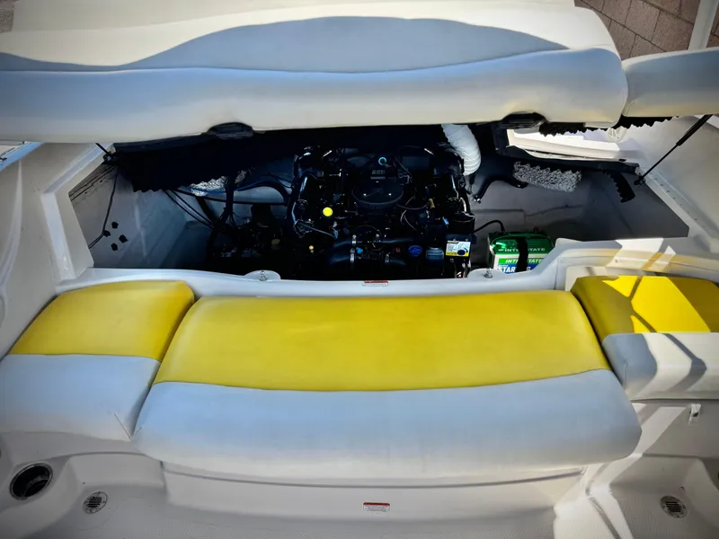 Slide: The Image of 2011 Tahoe Q8 SSi boat engine compartment with yellow seating. - 15