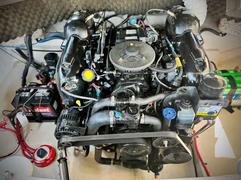 Slide: The Image of Engine of a 2011 Tahoe Q8 SSi boat, featuring various components and wiring. - 16