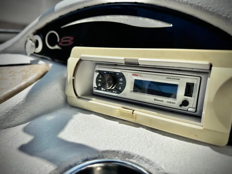 Slide: The Image of Dashboard of a 2011 Tahoe Q8 SSi boat featuring a stereo system. - 18