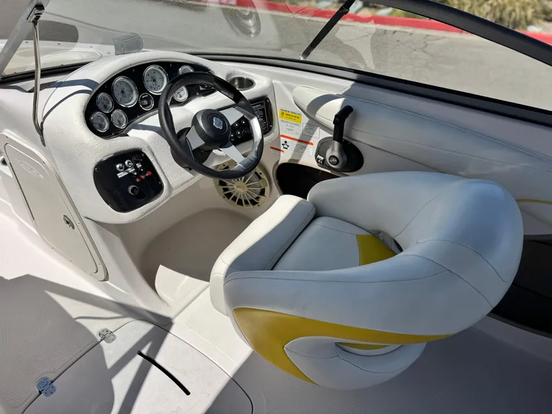 Slide: The Image of 2011 Tahoe Q8 SSi boat interior with steering wheel and dashboard controls. - 23