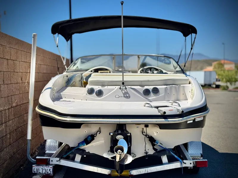 Slide: The Image of 2011 Tahoe Q8 SSi boat with canopy, parked on trailer, rear view. - 4