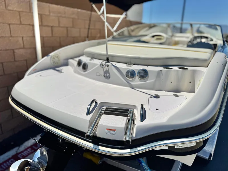 Slide: The Image of 2011 Tahoe Q8 SSi boat, rear view, showcasing swim platform and seating. - 6