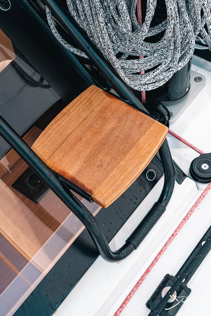 Slide: The Image of Deck detail of 2025 Nautitech 40 Open catamaran with wooden step and coiled rope. - 15