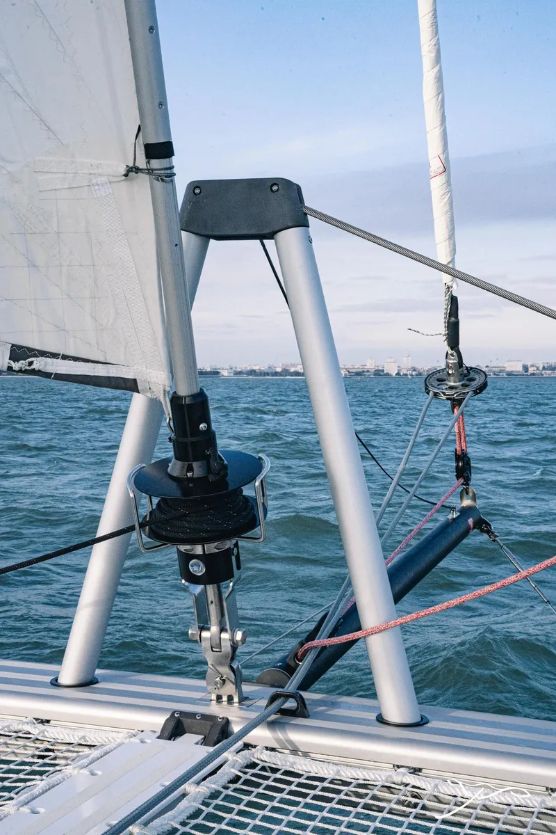 Slide: The Image of 2025 Nautitech 40 Open catamaran sailing on open water, showcasing rigging and sails. - 18