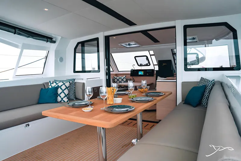 Slide: The Image of Luxurious interior of 2025 Nautitech 40 Open catamaran with elegant dining setup. - 21