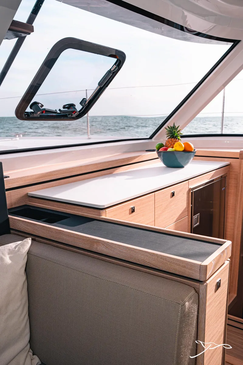 Slide: The Image of Modern interior of 2025 Nautitech 40 Open catamaran with fruit bowl on counter. - 33