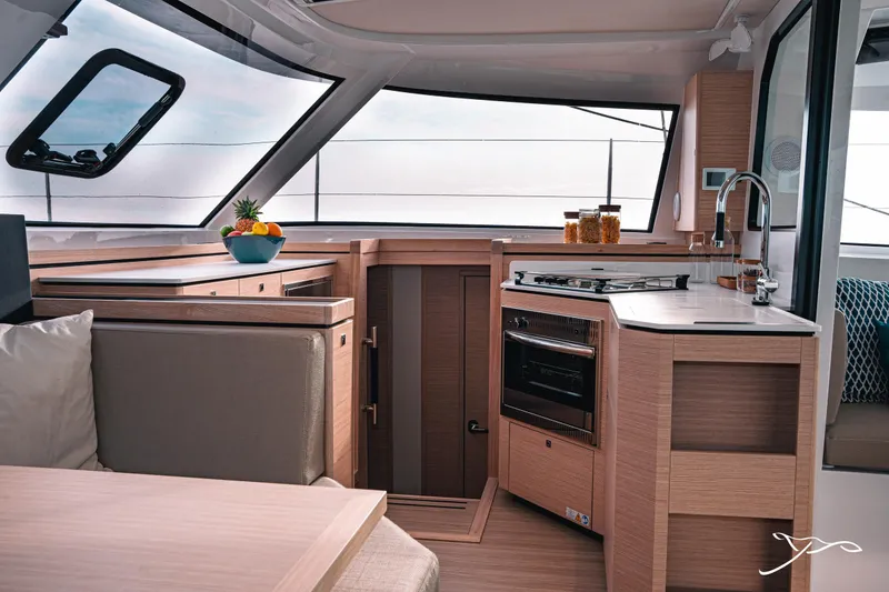 Slide: The Image of Modern kitchen interior of 2025 Nautitech 40 Open catamaran with sleek design and ample natural light. - 34