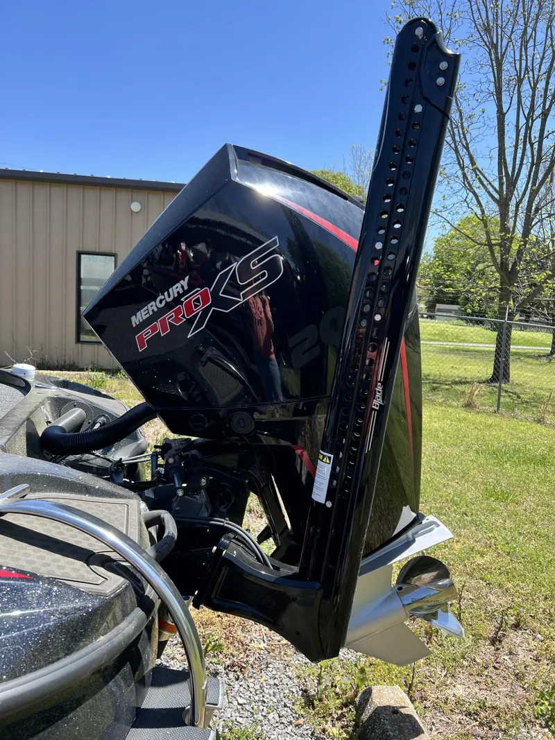 Slide: The Image of 2024 Nitro Z19 boat with Mercury Pro XS engine in a grassy yard. - 3
