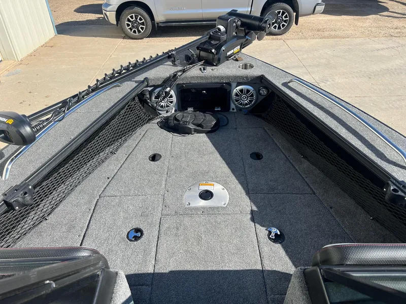 Slide: The Image of 2019 Alumacraft Trophy 175 boat interior with fishing gear and storage compartments. - 10