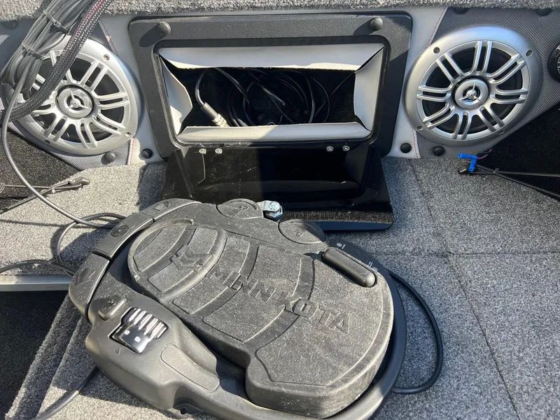 Slide: The Image of 2019 Alumacraft Trophy 175 boat interior with Minn Kota foot pedal and speakers. - 11