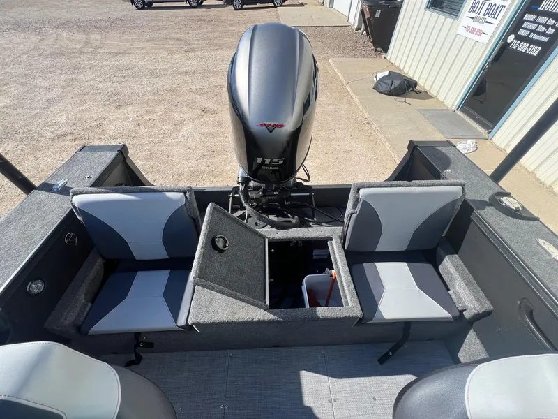 Slide: The Image of 2019 Alumacraft Trophy 175 boat interior with Yamaha 115 engine, featuring seating and storage. - 28