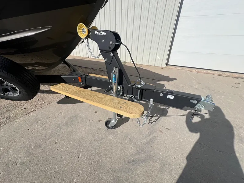 Slide: The Image of 2019 Alumacraft Trophy 175 boat trailer hitch with wooden step and winch. - 36