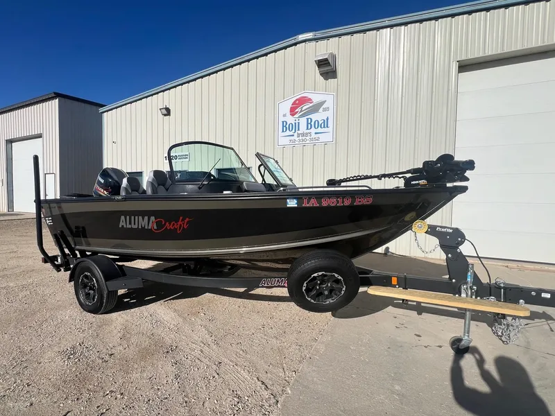 Slide: The Image of 2019 Alumacraft Trophy 175 boat on trailer outside Boji Boat Brokers building. - 4
