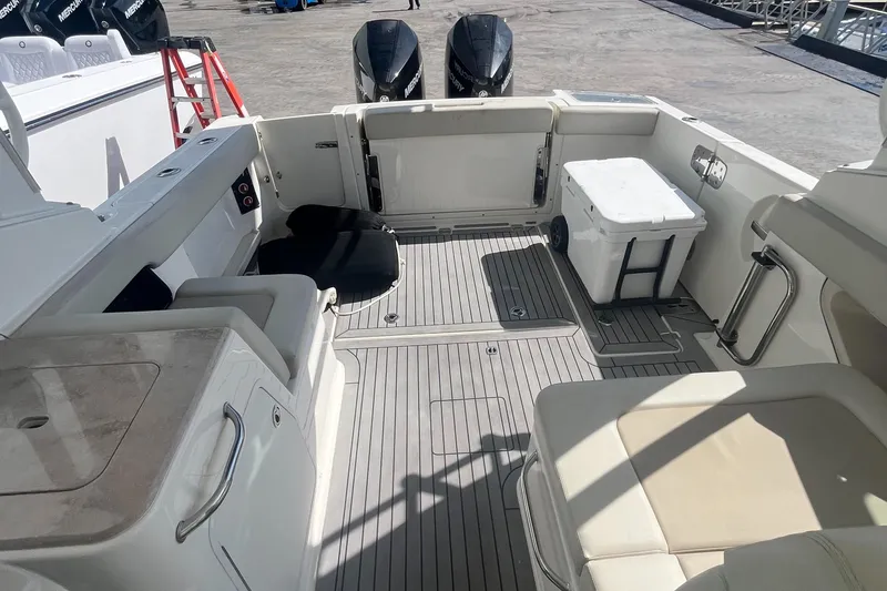 Slide: The Image of 2020 Boston Whaler 280 Vantage boat interior with seating and storage. - 13
