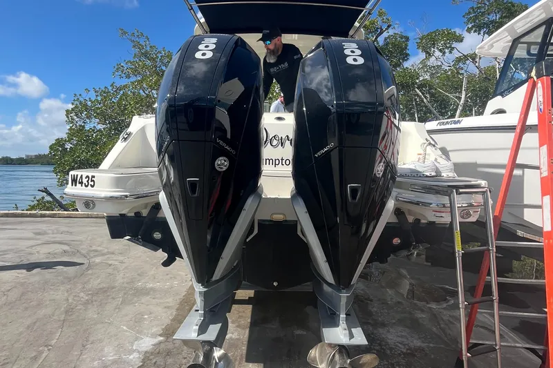 Slide: The Image of 2020 Boston Whaler 280 Vantage with dual outboard engines, docked near water. - 21