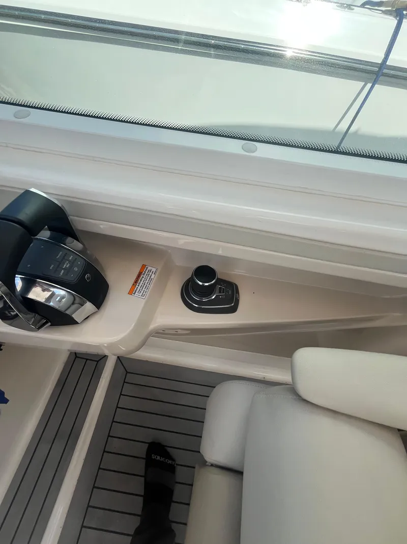 Slide: The Image of 2020 Boston Whaler 280 Vantage boat interior with control panel and seating. - 6