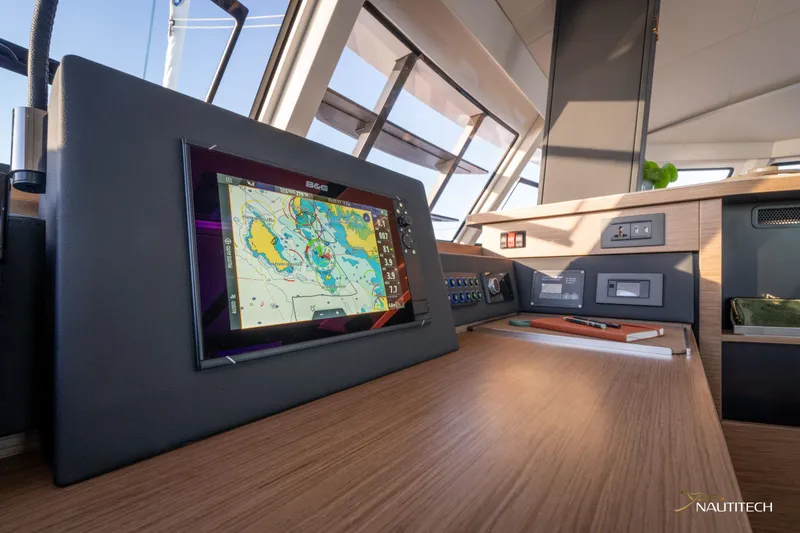 Slide: The Image of Modern navigation system on 2025 Nautitech 48 Open yacht's control panel. - 44