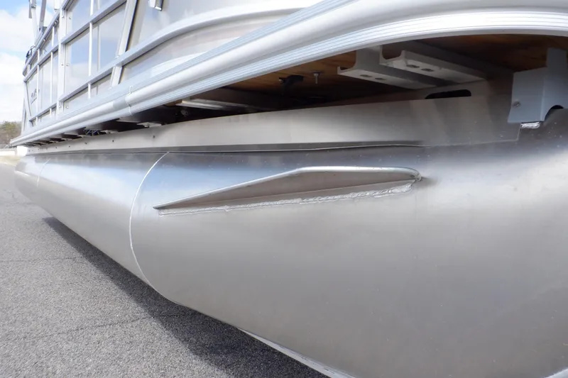 Slide: The Image of 2024 SunChaser Geneva Cruise 22 LR DH pontoon with visible dent on the side. - 11