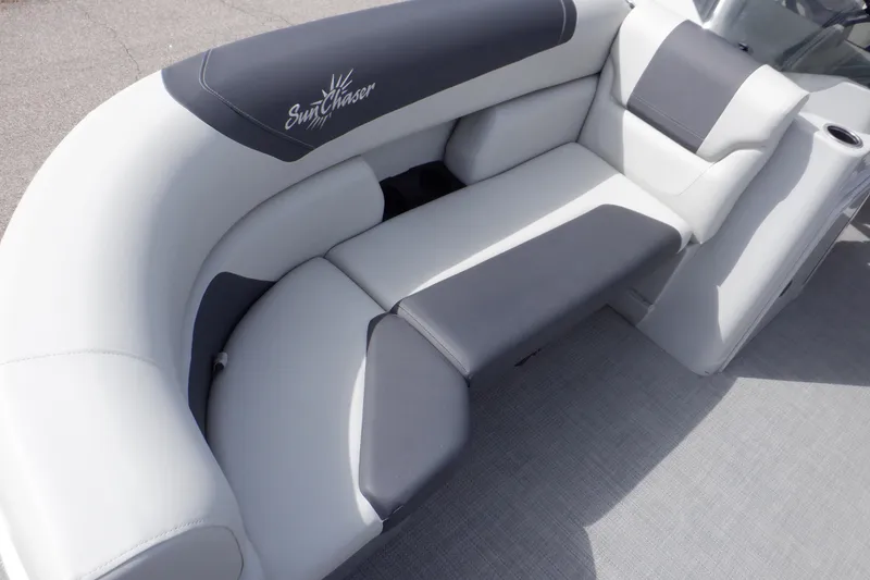 Slide: The Image of 2024 SunChaser Geneva Cruise 22 LR DH pontoon boat with canopy under a blue sky. - 14