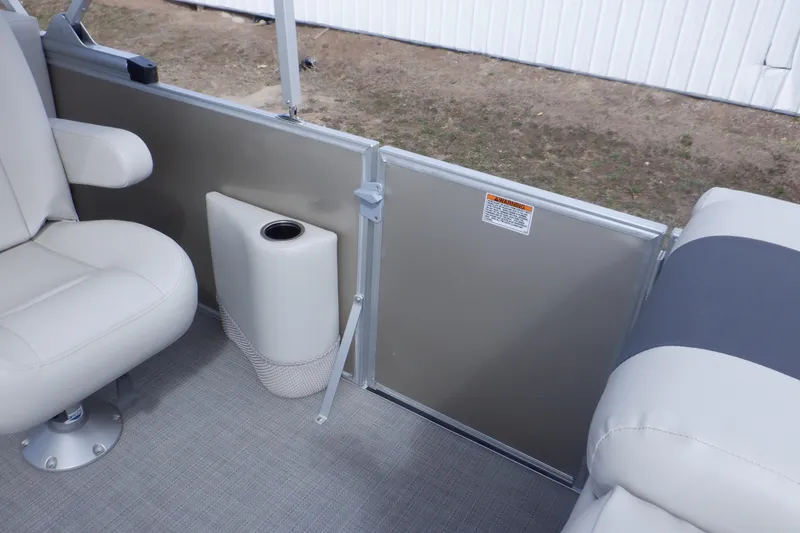 Slide: The Image of 2024 SunChaser Geneva Cruise 22 LR DH boat interior with gray and white seating. - 16