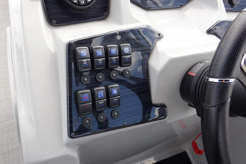 Slide: The Image of 2024 SunChaser Geneva Cruise 22 LR DH audio control panel with digital display and buttons. - 22