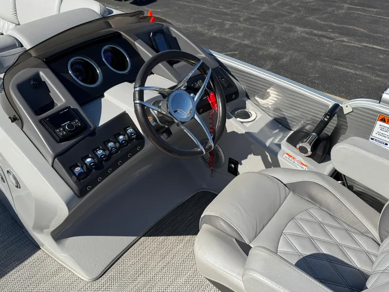 Slide: The Image of 2019 Bennington R 25 RSR boat interior with steering wheel and control panel. - 20