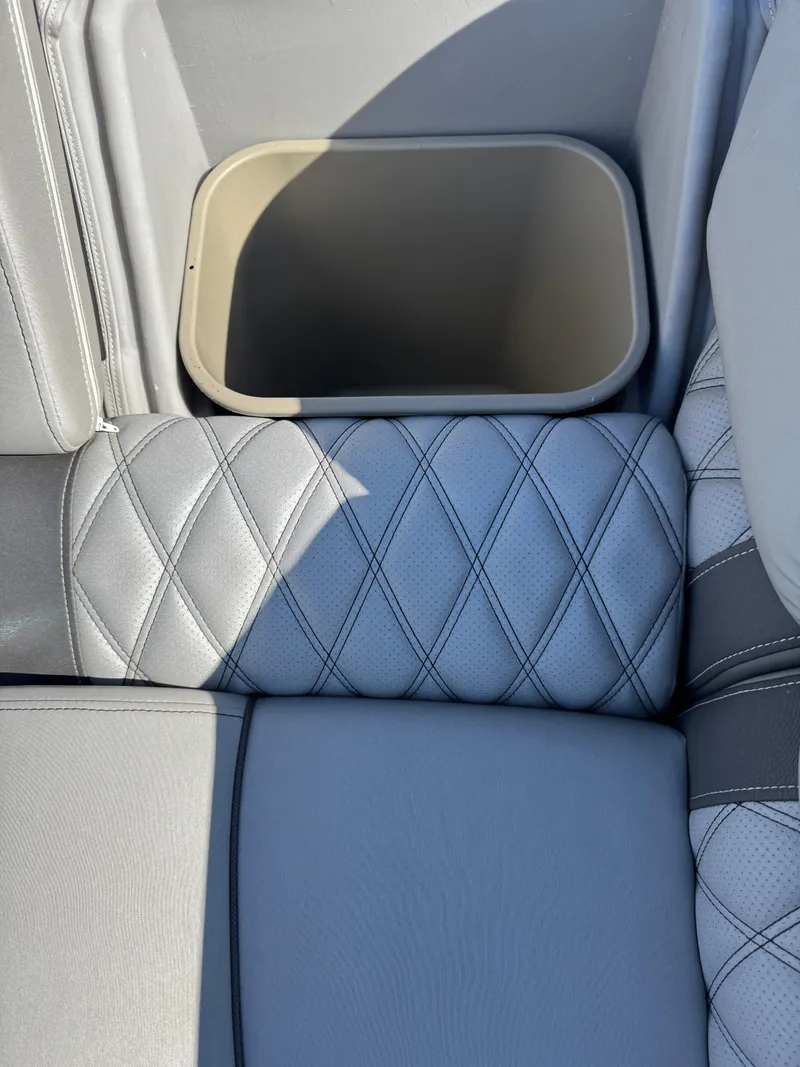 Slide: The Image of 2019 Bennington R 25 RSR boat seat with diamond-pattern upholstery and storage compartment. - 28